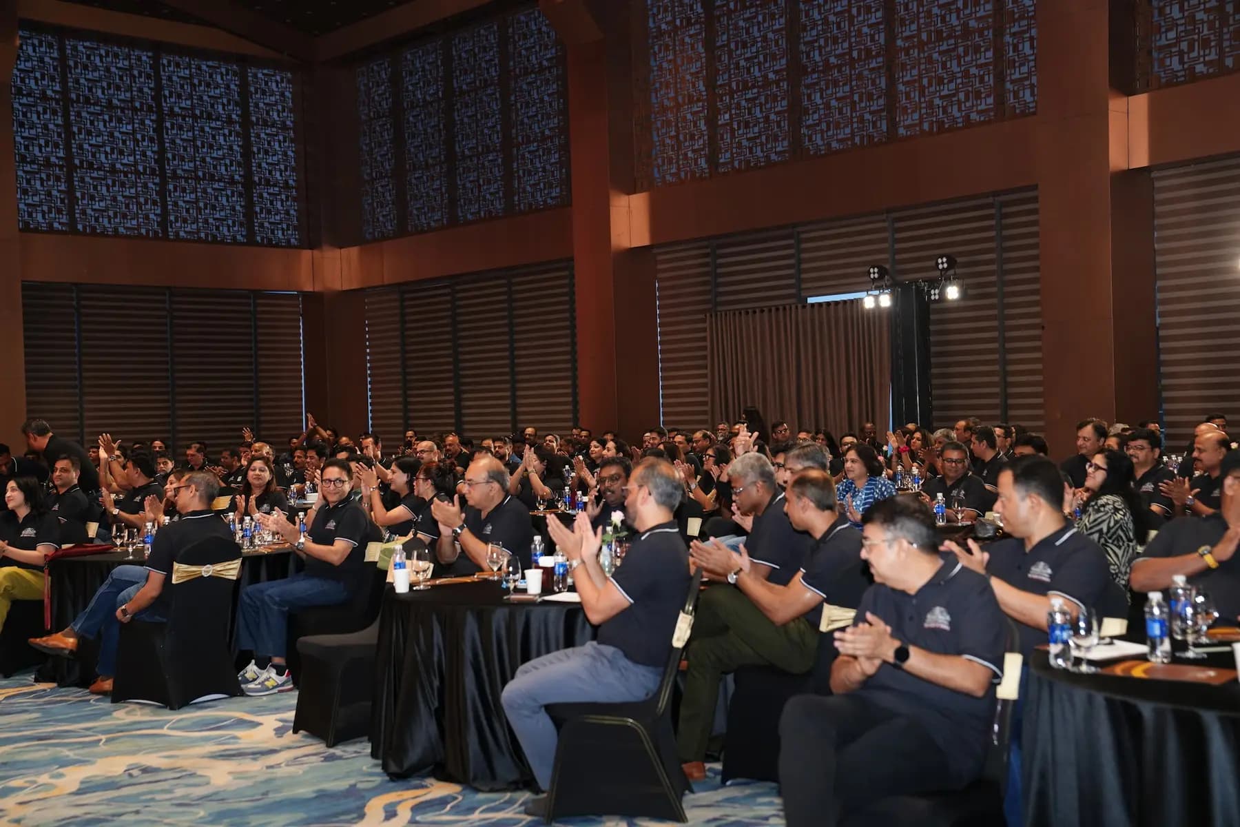 Conference audience seated at round tables