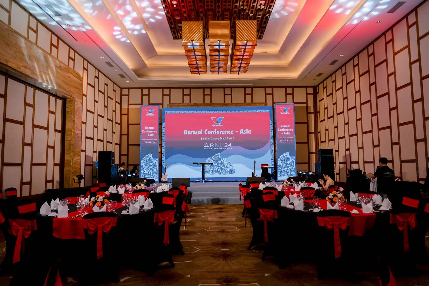Ballroom dressed in red and black for the gala night, facing the LED stage