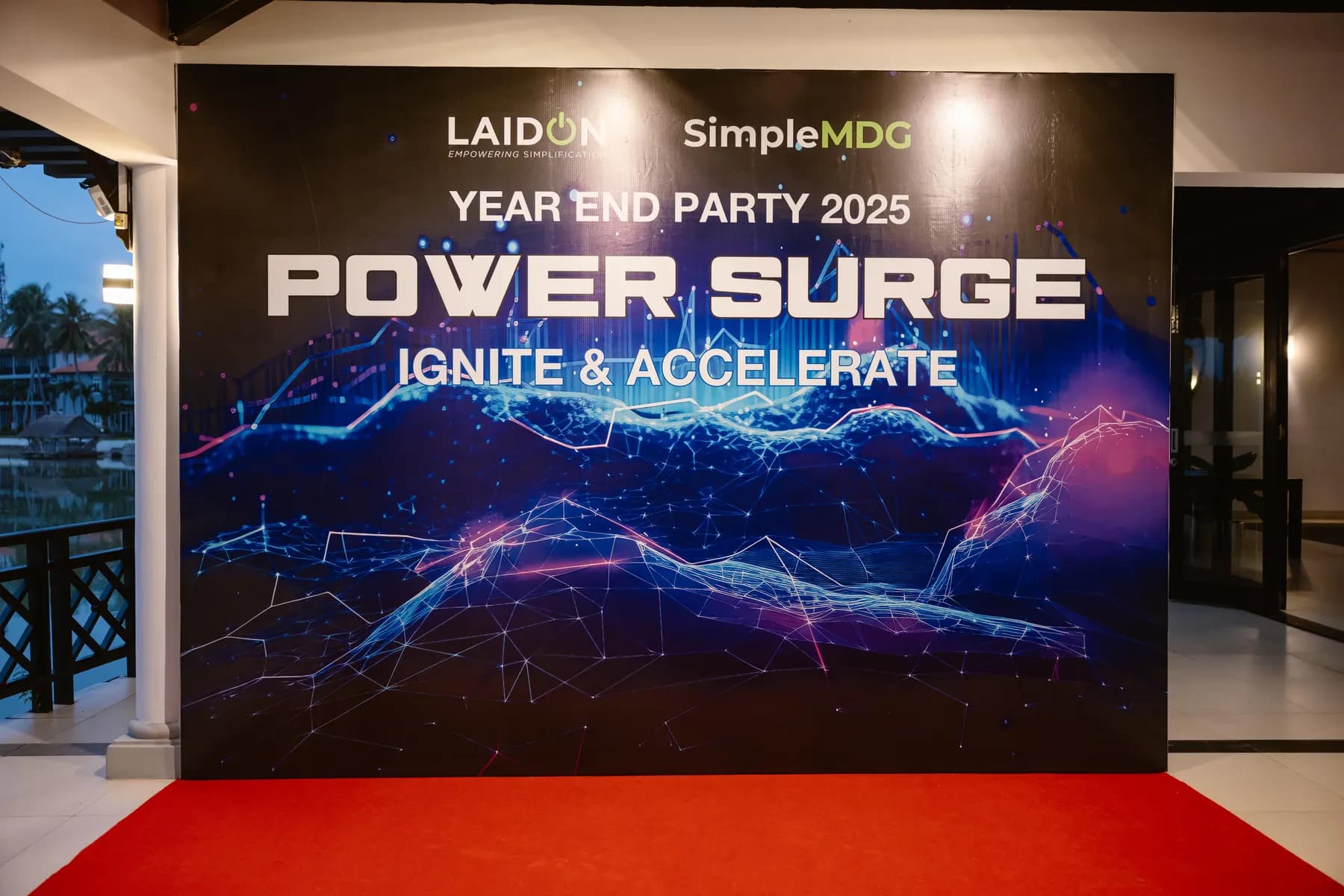 Year End Party 2025 Power Surge backdrop above the red carpet