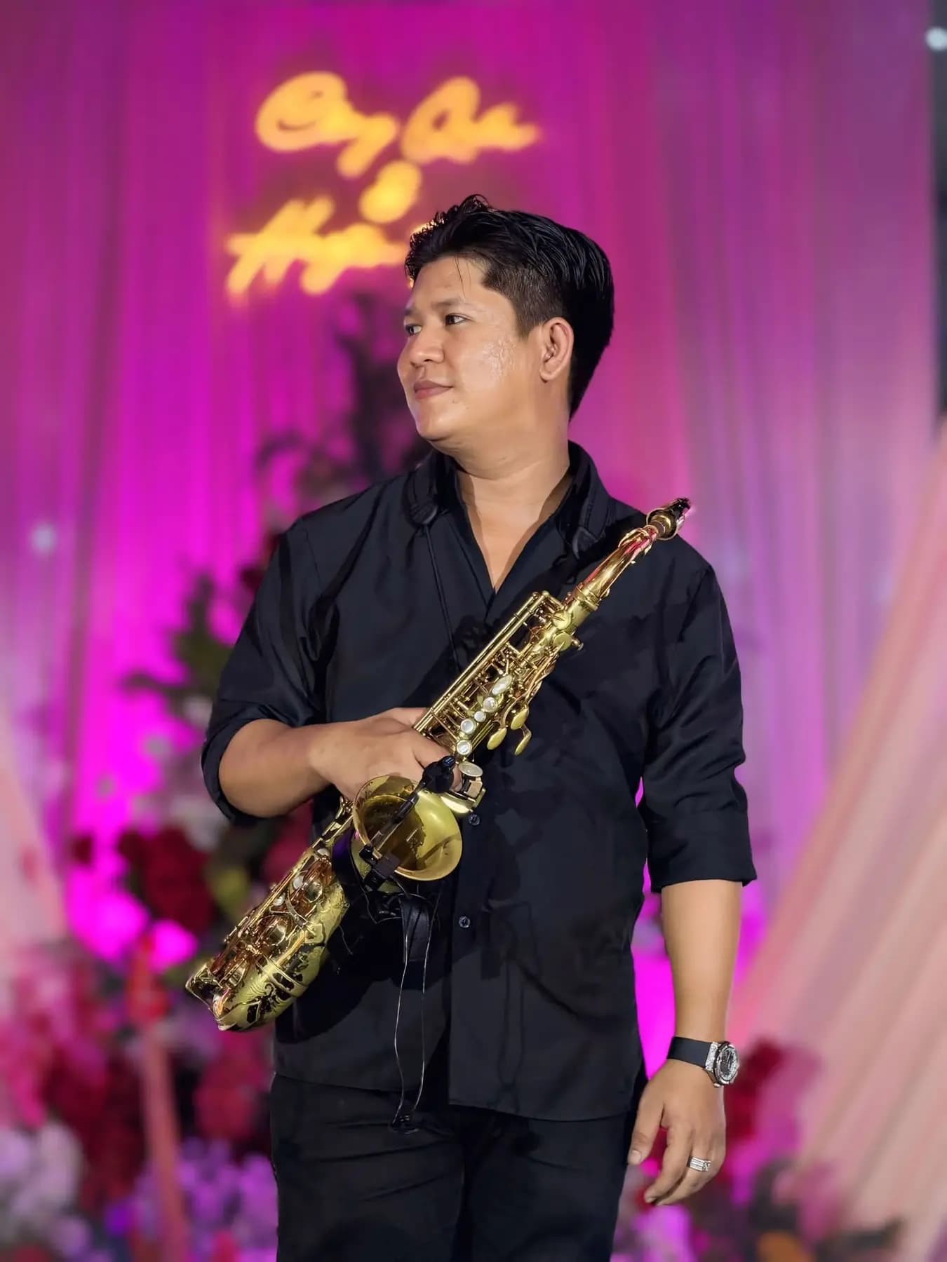 Saxophonist performing on a wedding stage