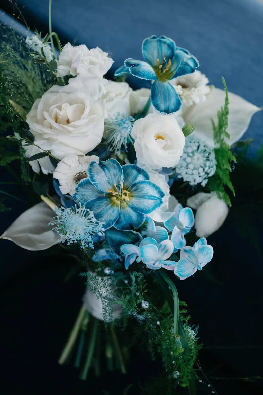 Bridal bouquet of white and blue flowers